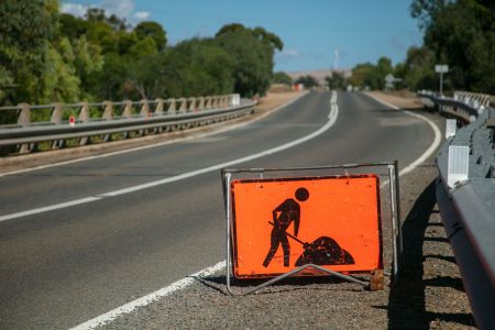 Road maintenance sign on sealed road