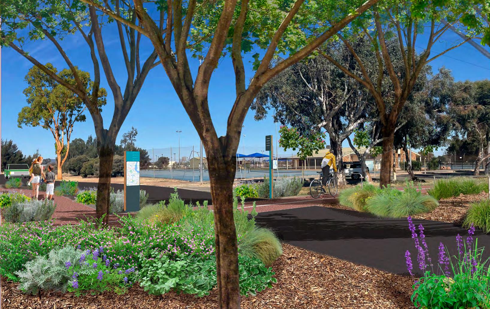 greenery with a path and cyclist