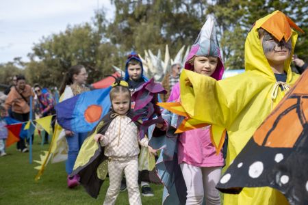 Children dressed as colourful animals for the Nylon Zoo Animal Parade at the 2024 Festival