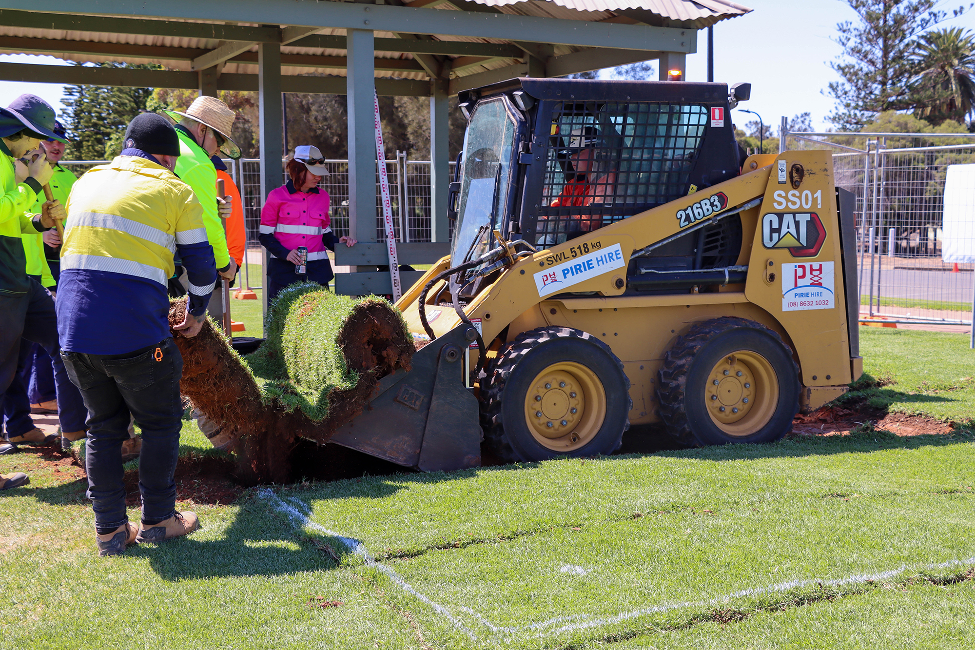 work hardening 2023 participants installing turf at beach